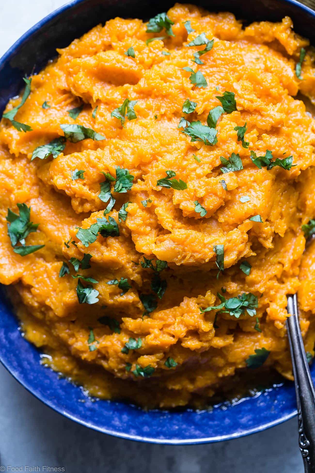 Coconut Curry Mashed Sweet Potatoes - This healthy mashed sweet potatoes recipe is a sweet and spicy spin on a holiday classic!  So creamy you will never believe they are dairy, grain and gluten free and paleo/vegan/whole30 compliant! | Foodfaithfitness.com | @FoodFaithFit