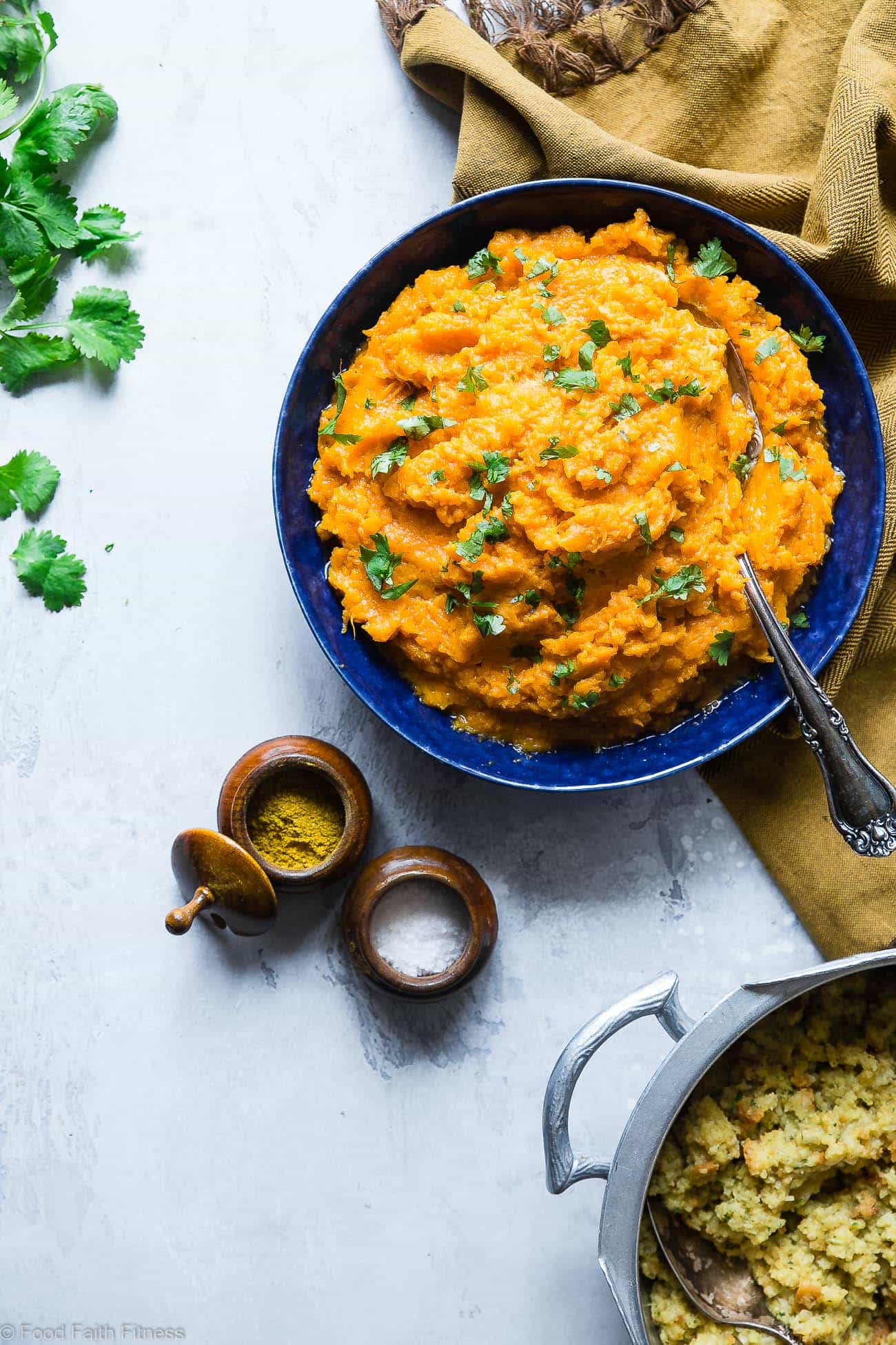 Curried Savory Vegan Healthy Mashed Sweet Potatoes - Ever wondered how to make healthy mashed sweet potatoes? This recipe is a sweet and spicy spin on a holiday classic!  So creamy you will never believe they are dairy, grain and gluten free and paleo/vegan/whole30 compliant! | Foodfaithfitness.com | @FoodFaithFit