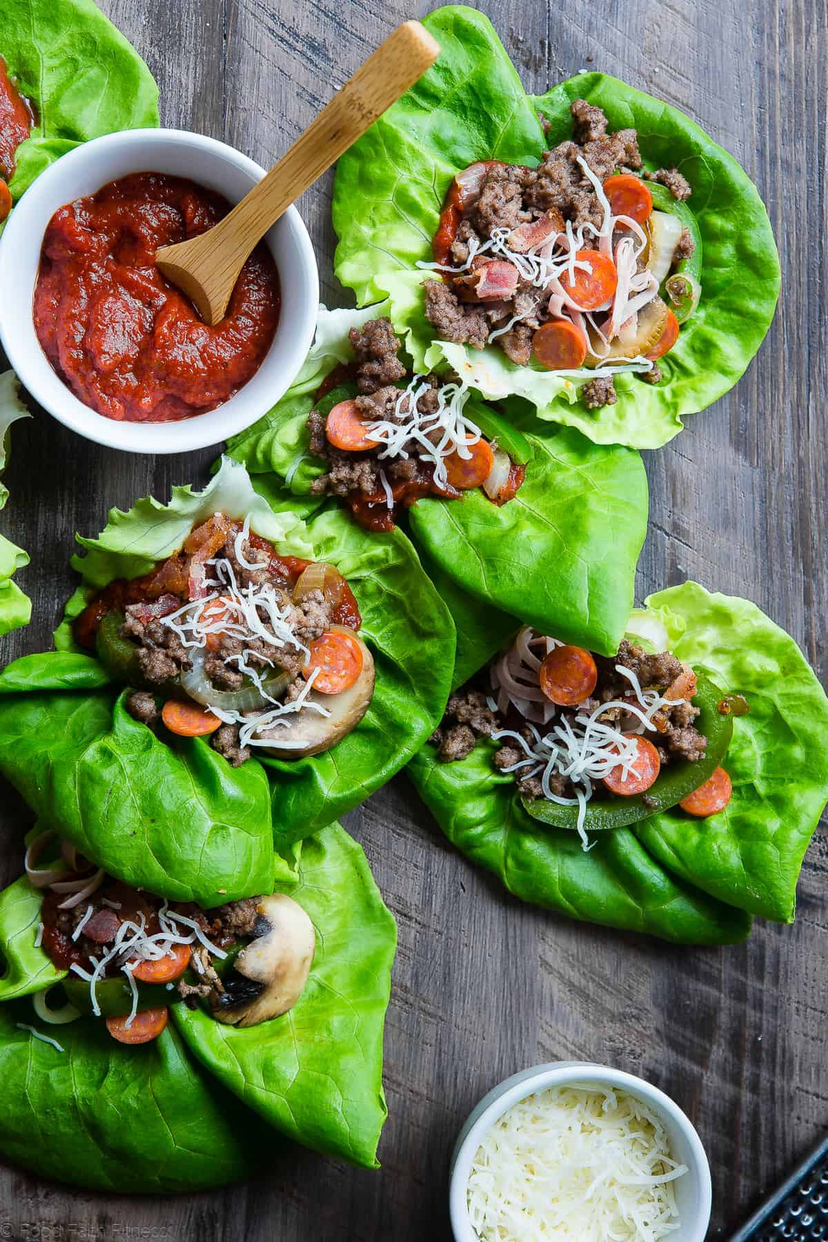 low carb lettuce wraps arranged on a table with sauce on the side