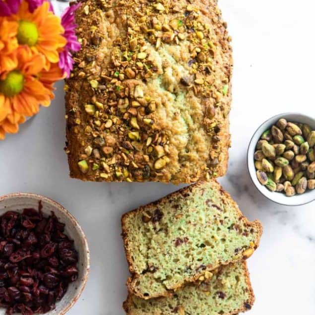 pistachio bread sliced on a table with flowers