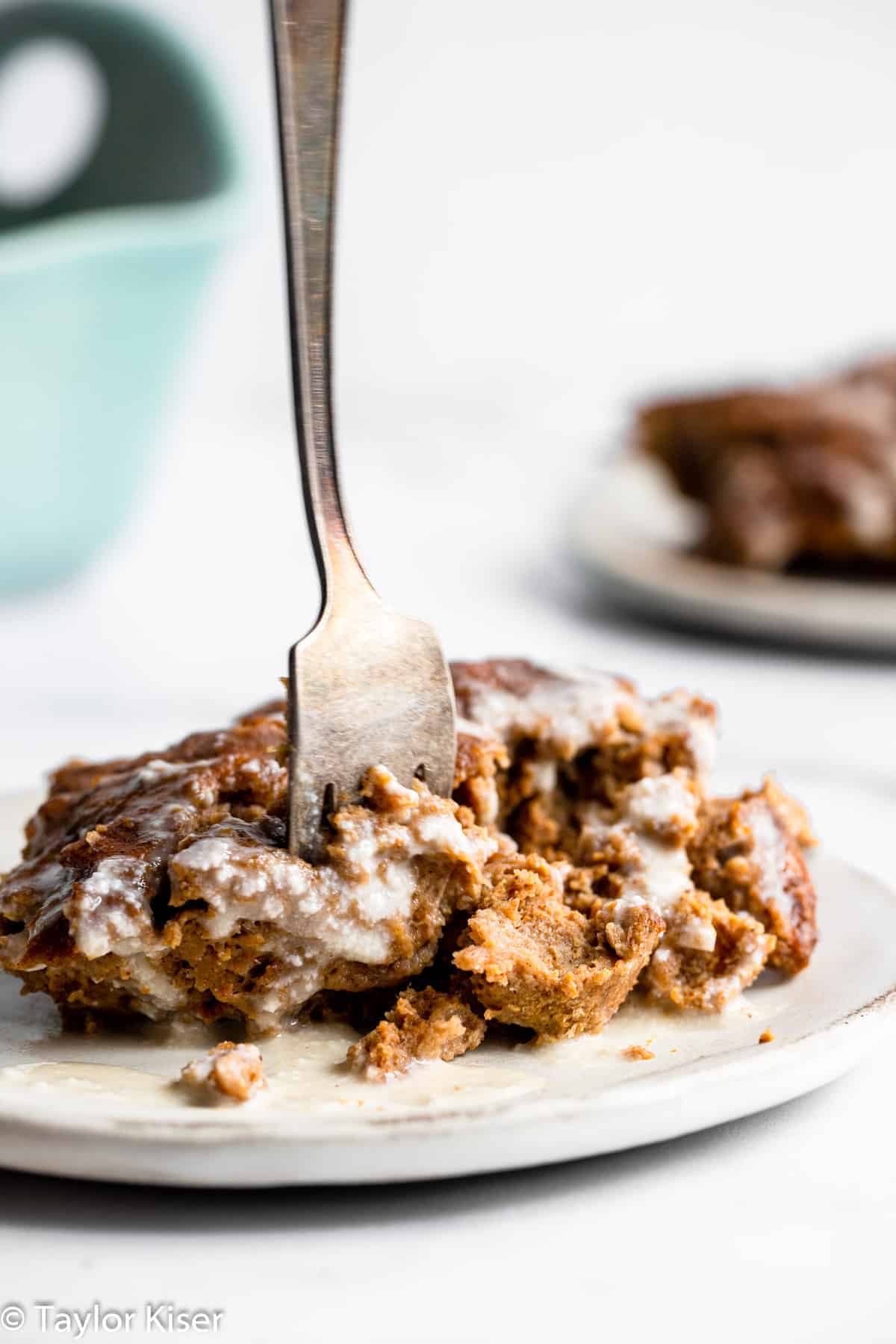A fork sticking into overnight pumpkin french toast casserole