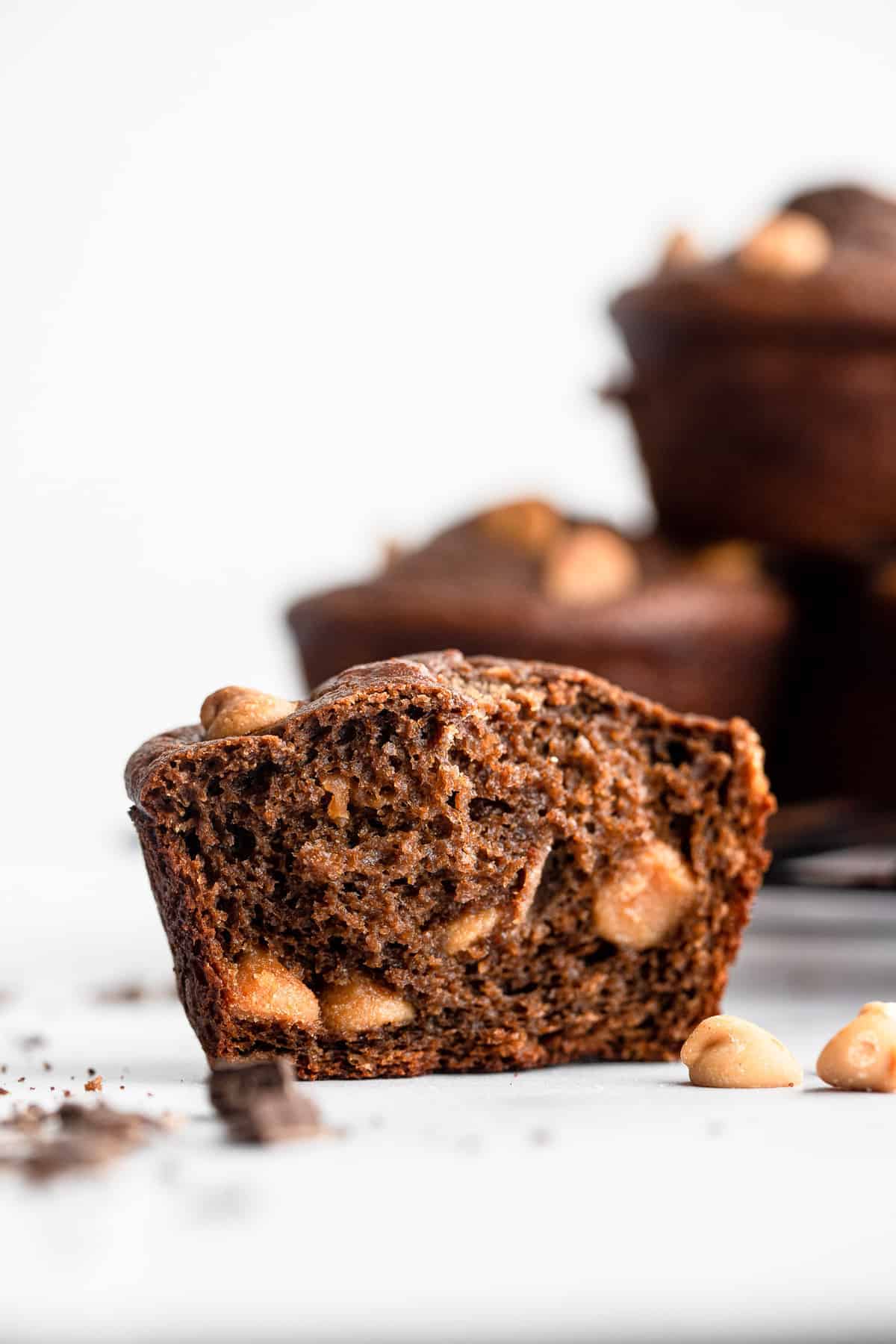 healthy chocolate peanut butter muffins with a bite taken out of it