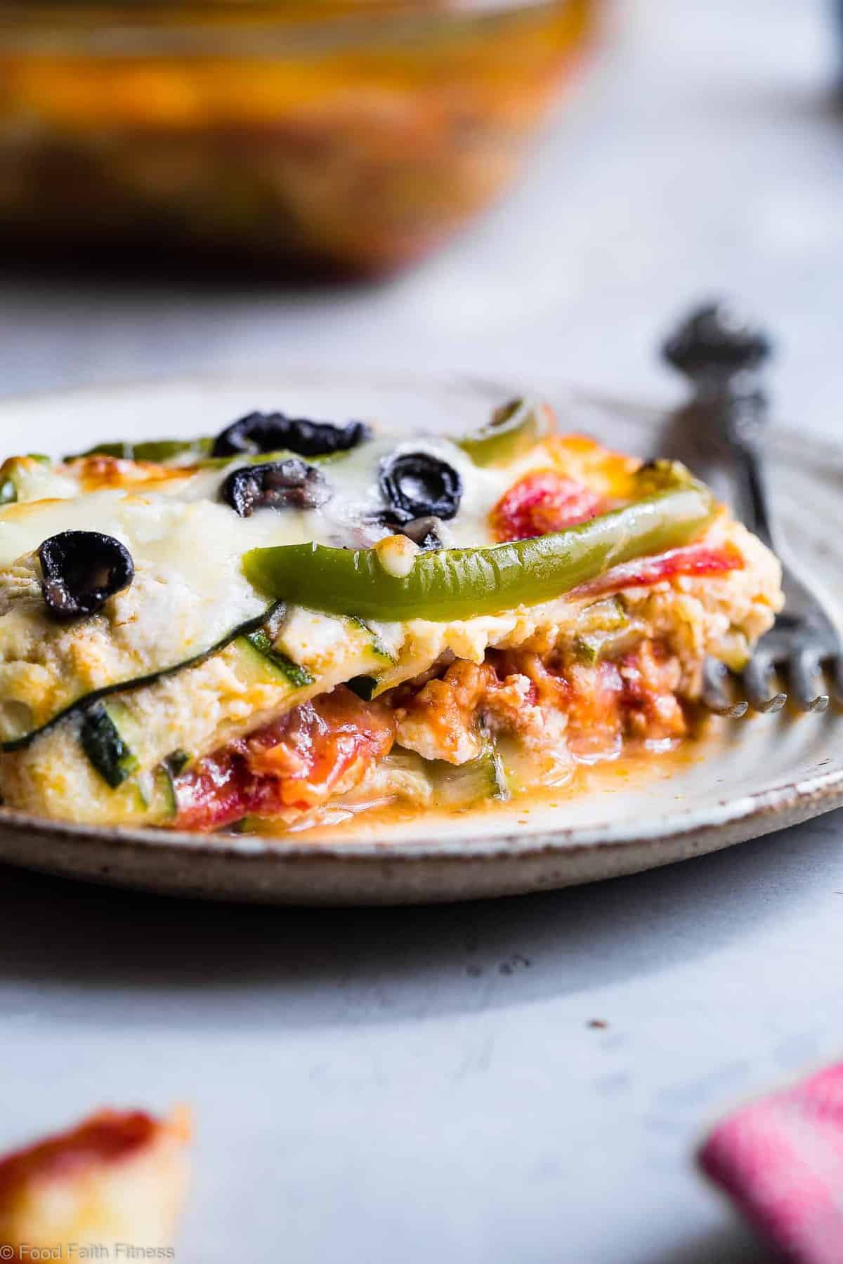 Low Carb Zucchini Pizza Lasagna - This zucchini lasagna combines 2 classic comfort foods into one healthy and kid friendly dinner! Gluten free, under 300 calories and packed with protein too! | #Foodfaithfitness.com | #Glutenfree #Lowcarb #Healthy #KidFriendly #Lasagna