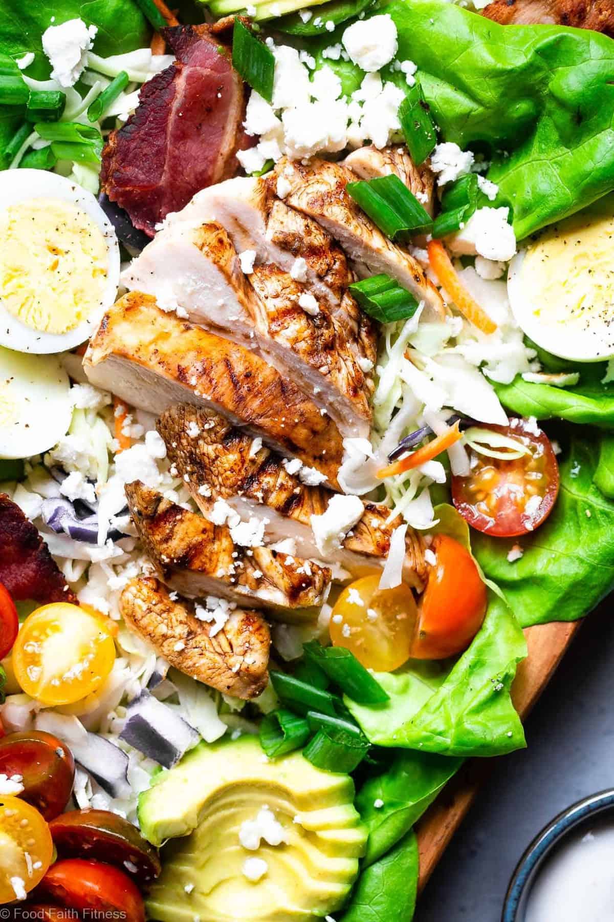 Healthy Chicken Cobb Salad Recipe - This quick, easy skinny Chicken Cobb Salad Recipe is a lighter remake that cuts over half the calories of the classic but not the taste! No one will know it's lighter, gluten free and lower carb! | #Foodfaithfitness | #Glutenfree #lowcarb #healthy #salad #grainfree