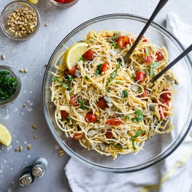 Gluten Free Lemon Artichoke Spaghetti Pasta Salad- A simple, healthy, vegan friendly pasta salad with creamy, roasted artichokes, bright fresh basil, garlic and lemon vinaigrette! Big flavors, so easy and great for Spring or Potlucks! | #Foodfaithfitness | #Vegan #Glutenfree #Healthy #Pastasalad #Dairyfree
