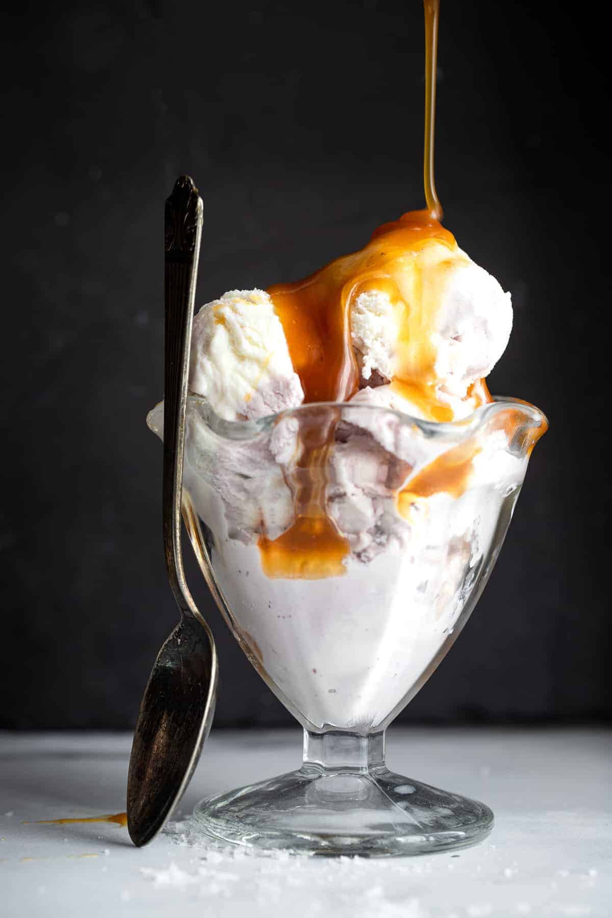 dairy free vegan caramel sauce being drizzled on ice cream