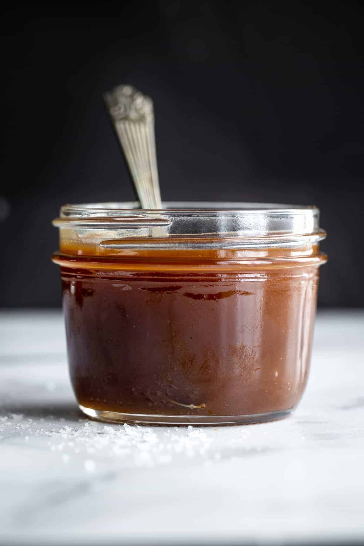 dairy free caramel sauce in a glass jar