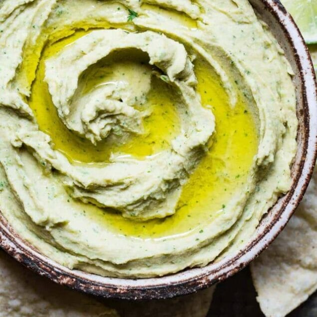 Cilantro Lime Jalapeno Hummus - This spicy, ADDICTING homemade hummus recipe doesn't use tahini so it's SO easy to make! Perfect for snacks, or spreading on a sandwich and gluten free, vegan and healthy too! | #Foodfaithfitness | #Vegan #Glutenfree #Healthy #Dairyfree #Hummus