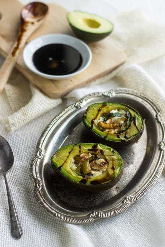 Zucchini and Goat Cheese Stuffed Balsamic Avocados - A quick, easy and healthy snack! - Food Faith Fitness | #healthysnack #avocado #glutenfree