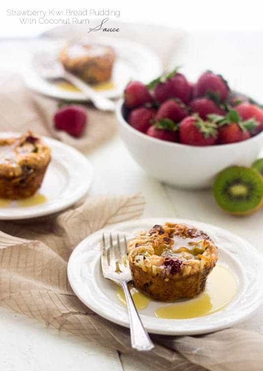 Strawberry Kiwi Bread Puddings with Coconut Rum Sauce - Pretty much your new favorite dessert. | Food Faith Fitness| #breadpudding #dessert #recipe