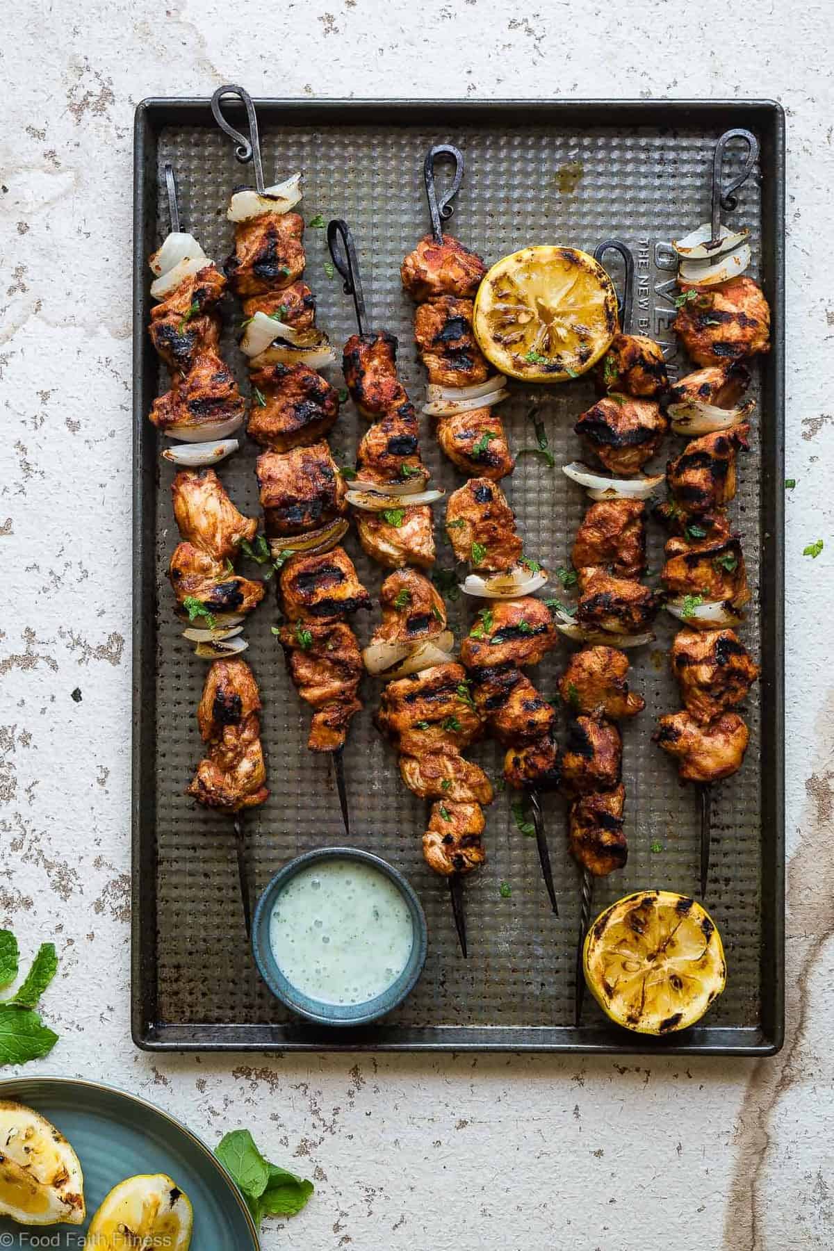 Tomato Grilled Moroccan Chicken Kebabs -Â These quick and easy, low carb Grilled Moroccan ChickenÂ skewers are complete with a healthy, high protein yogurt mint sauce! Gluten free, only 1 Weight Watchers Freestlye point and SO delicious! | #Foodfaithfitness | #Lowcarb #WeightWatchers #Glutenfree #Healthy #Grilling
