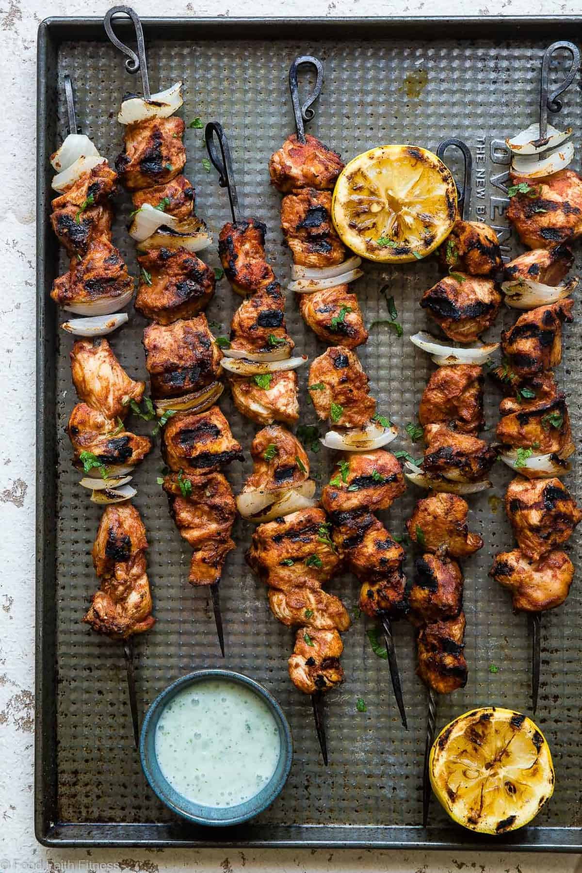 Grilled Moroccan Chicken Kebabs - These quick and easy, low carb Grilled Moroccan Chicken skewers are complete with a healthy, high protein yogurt mint sauce! Gluten free, only 1 Weight Watchers Freestlye point and SO delicious! | #Foodfaithfitness | #Lowcarb #WeightWatchers #Glutenfree #Healthy #Grilling