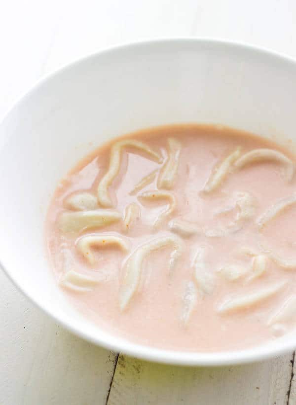 Baked Coconut Calamari with Spicy Yogurt - You won't miss the fried stuff, I promise! | Foodfaithfitness.com | #appetizer #recipe #Greekyogurt