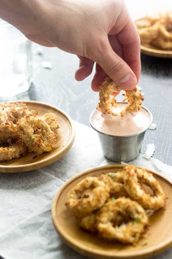 Baked Coconut Calamari with Spicy Yogurt - You won't miss the fried stuff, I promise! | Foodfaithfitness.com | #appetizer #recipe #Greekyogurt