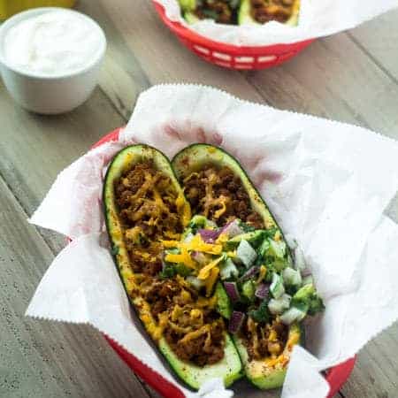 Mexican Stuffed Zucchini with Avocado Salsa - SO yummy, healthy and great for school nights! | Foodfaithfitness.com | #glutenfree #lowcarb #recipe #zucchini