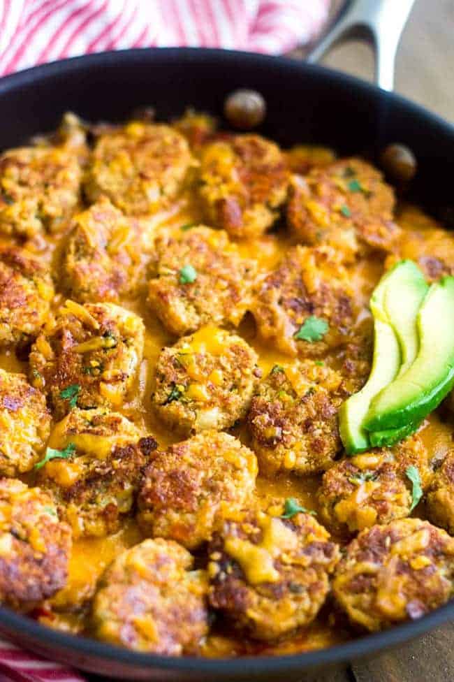 Mexican Cauliflower Tater tot Casserole - So ooey, gooey and cheesy you would never know it's #lowcarb and #healthy! | Foodfaithfitness.com | #recipe #gameday #cauliflower
