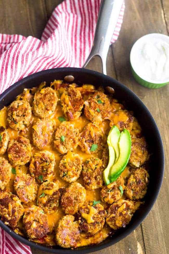 Mexican Cauliflower Tater tot Casserole - So ooey, gooey and cheesy you would never know it's #lowcarb and #healthy! | Foodfaithfitness.com | #recipe #gameday #cauliflower