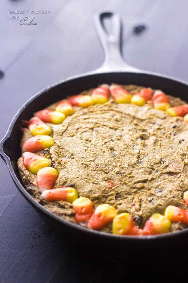 Healthy Halloween Skillet Cookies - 100% Whole Wheat, Butter/oil free and SO thick and chewy. You NEED to try this cookie! | Foodfaithfitness.com | #halloween #skilletcookie #recipe #candycorn