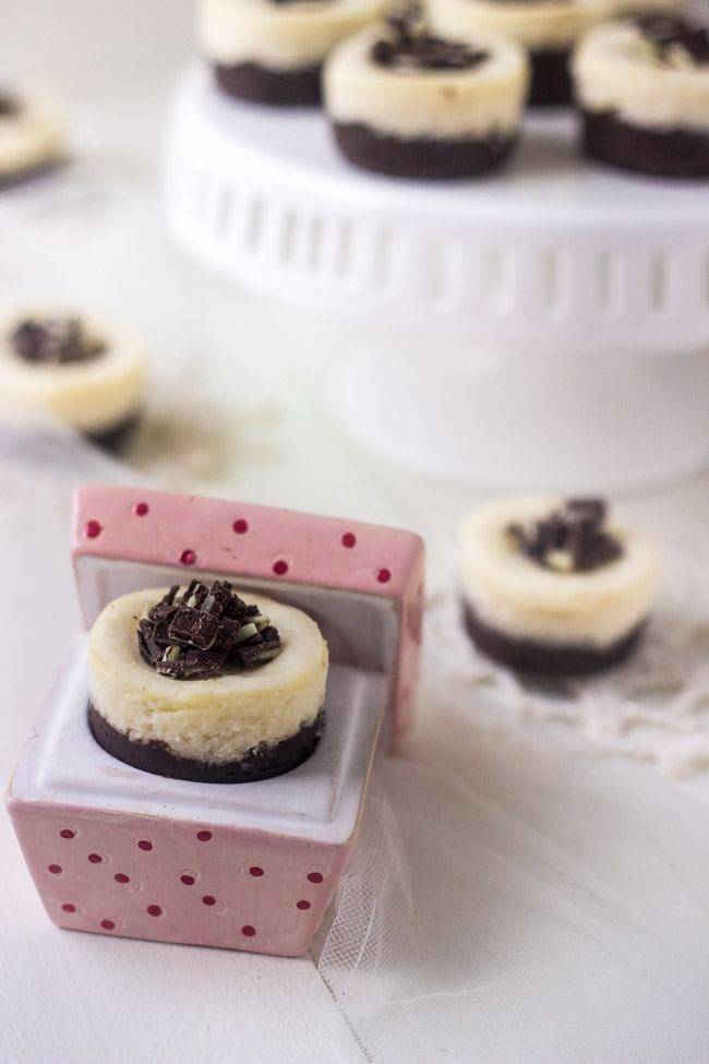 Mini Mint White Chocolate Brownie Cheesecakes - So perfect for Christmas! They are so creamy, but only 150 calories and gluten free! | Foodfaithfitness.com | #cheesecake #recipe