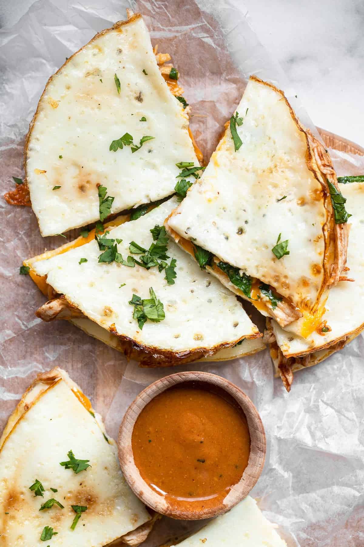 close up of healthy chicken quesadillas on a cutting board