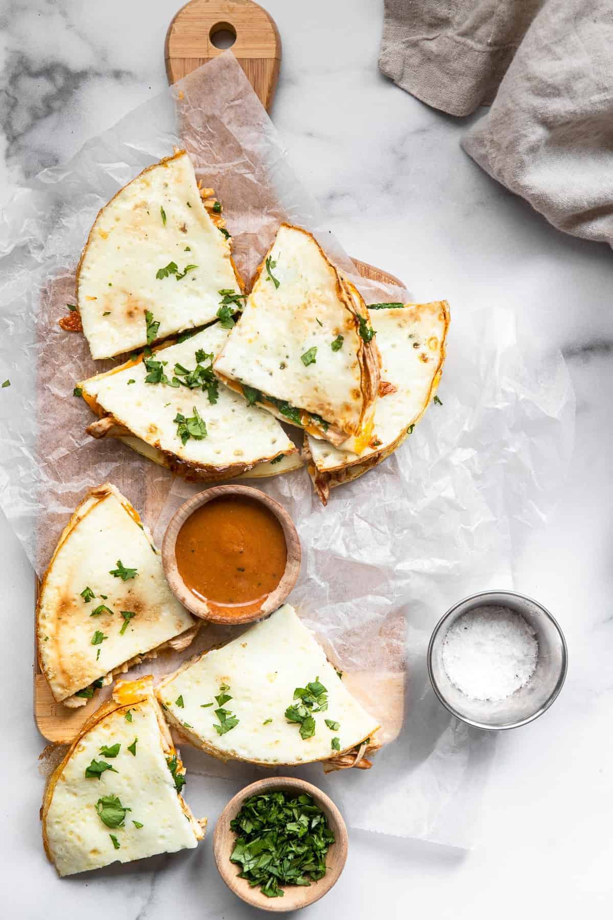 Low Carb Healthy Quesadillas on a cutting board with cilantro