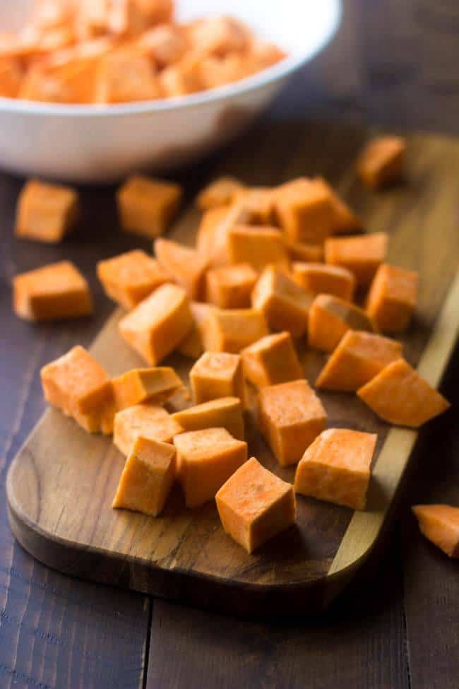 Maple Curry Roasted Sweet Potatoes - A quick and easy side dish that is perfect for a light and healthy Thanksgiving option, that your family will love! | Foodfaithfitness.com | #recipe