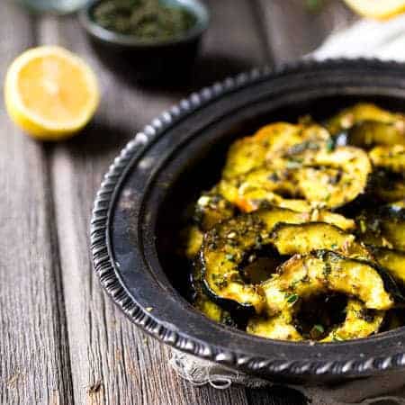 Pamesan Toasted Acorn Squash with Sage Kale Pesto - An easy side dish that is perfect for entertaining or a weeknight dinner! | Foodfaithfitness.com | #recipe