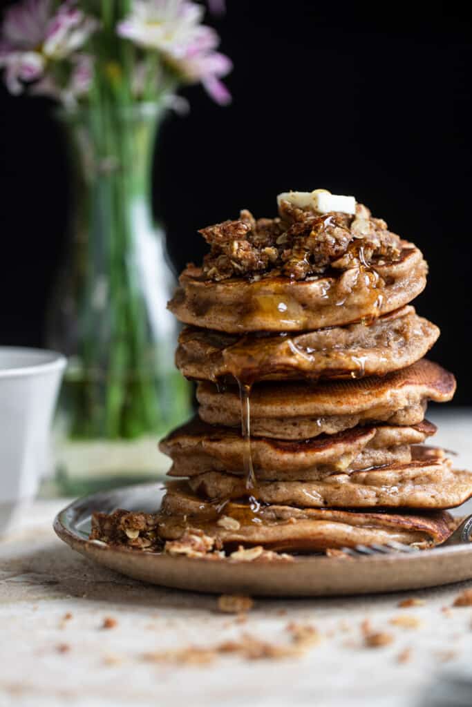 side view of a large stack of healthy apple pancakes