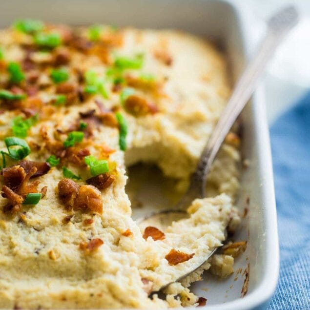 Low Carb Bacon and Goat Cheese Cauliflower Bake - This baked cauliflower is SO creamy and no one ever knows it's made of veggies. You would never guess it's an easy, healthy, low carb and gluten free side dish that even kids love! | Foodfaithfitness.com | @FoodFaithFit