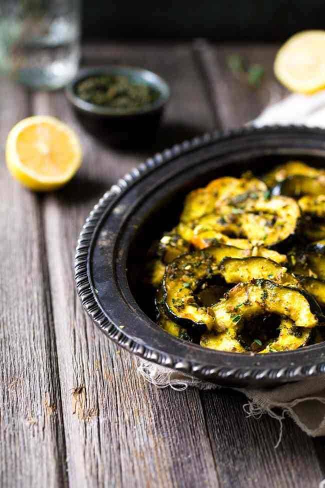 Pamesan Toasted Acorn Squash with Sage Kale Pesto - An easy side dish that is perfect for entertaining or a weeknight dinner! | Foodfaithfitness.com | #recipe