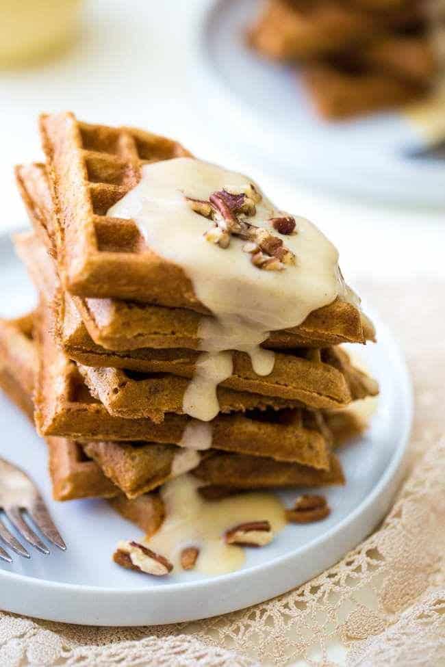 The Best Waffles with Eggnog Cream Sauce - Seriously. These are absolutely AMAZING! Light, crispy and perfect for Christmas morning! | Foodfaithfitness.com | #recipe