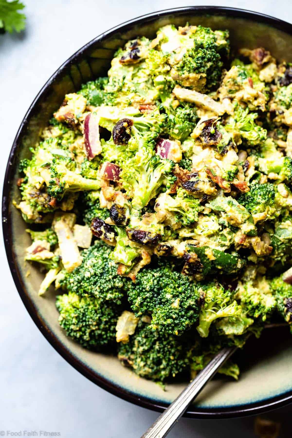 Curried Vegan Paleo Broccoli Cashew Salad -  This easy healthy broccoli salad is jazzed up with a curried cashew cream dressing. It's a quick, easy, gluten and dairy free side that's always a crowd pleaser! | #Foodfaithfitness | #Glutenfree #Paleo #Vegan #Dairyfree #Healthy