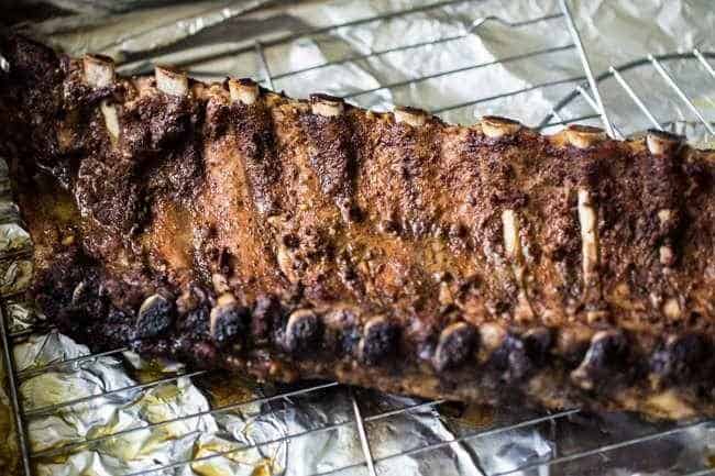 Paleo 5 Spice Honey Garlic Oven Baked Ribs - Sticky, sweet, healthier ribs that are gluten free, Paleo and made in the oven. These fall RIGHT OFF THE BONE! | Foodfaithfitness.com | @FoodFaithFit