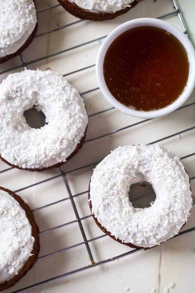 Gluten Free Carrot Cake Baked Donuts - Made in one bowl, healthy and Paleo friendly! Coconut cream frosting add the perfect, Easter touch! | Foodfaithfitness.com | @FoodFaithFit