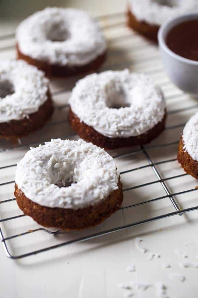 Gluten Free Carrot Cake Baked Donuts - Made in one bowl, healthy and Paleo friendly! Coconut cream frosting add the perfect, Easter touch! | Foodfaithfitness.com | @FoodFaithFit