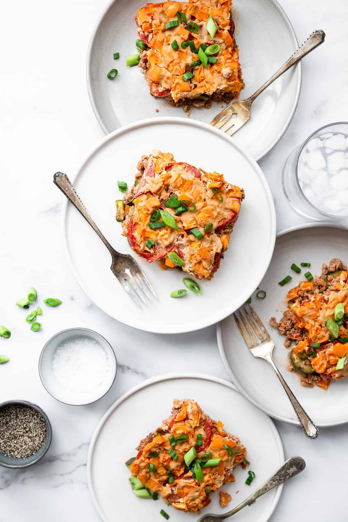 paleo chicken casserole on 3 plates stacked on top of each other