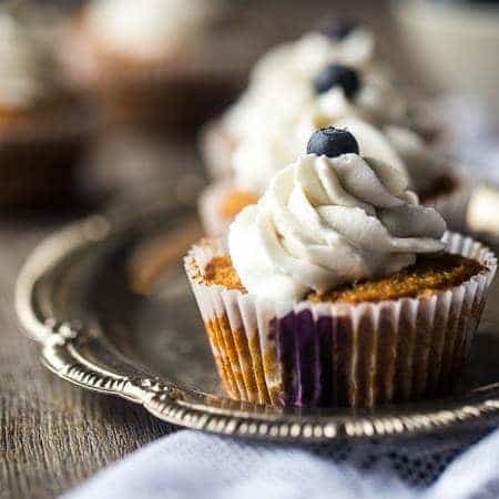 Blueberry Gluten Free Cupcakes with Coconut Cream – These cupcakes mixed with fresh blueberries and topped with coconut cream are a healthier, Paleo-friendly dessert that is perfect for Summer! | Foodfaithfitness.com | @FoodFaithFit