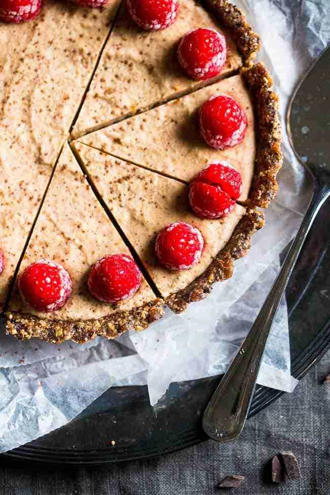 No-Bake Salted Chocolate Tart with Almond Cream - This easy tart is made from almonds and dates, then frozen and filled with almond cream. A healthy and gluten free dessert that can be made in advance! | Foodfaithfitness.com | @FoodFaithFit