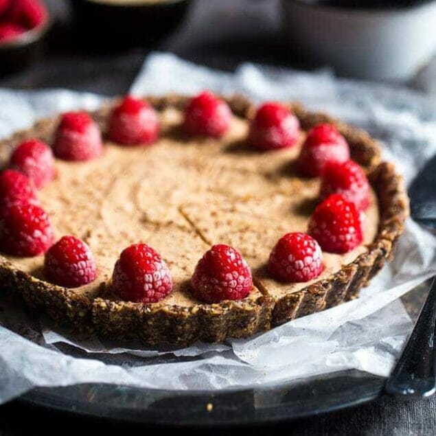 No-Bake Salted Chocolate Tart with Almond Cream - This easy tart is made from almonds and dates, then frozen and filled with almond cream. A healthy and gluten free dessert that can be made in advance! | Foodfaithfitness.com | @FoodFaithFit