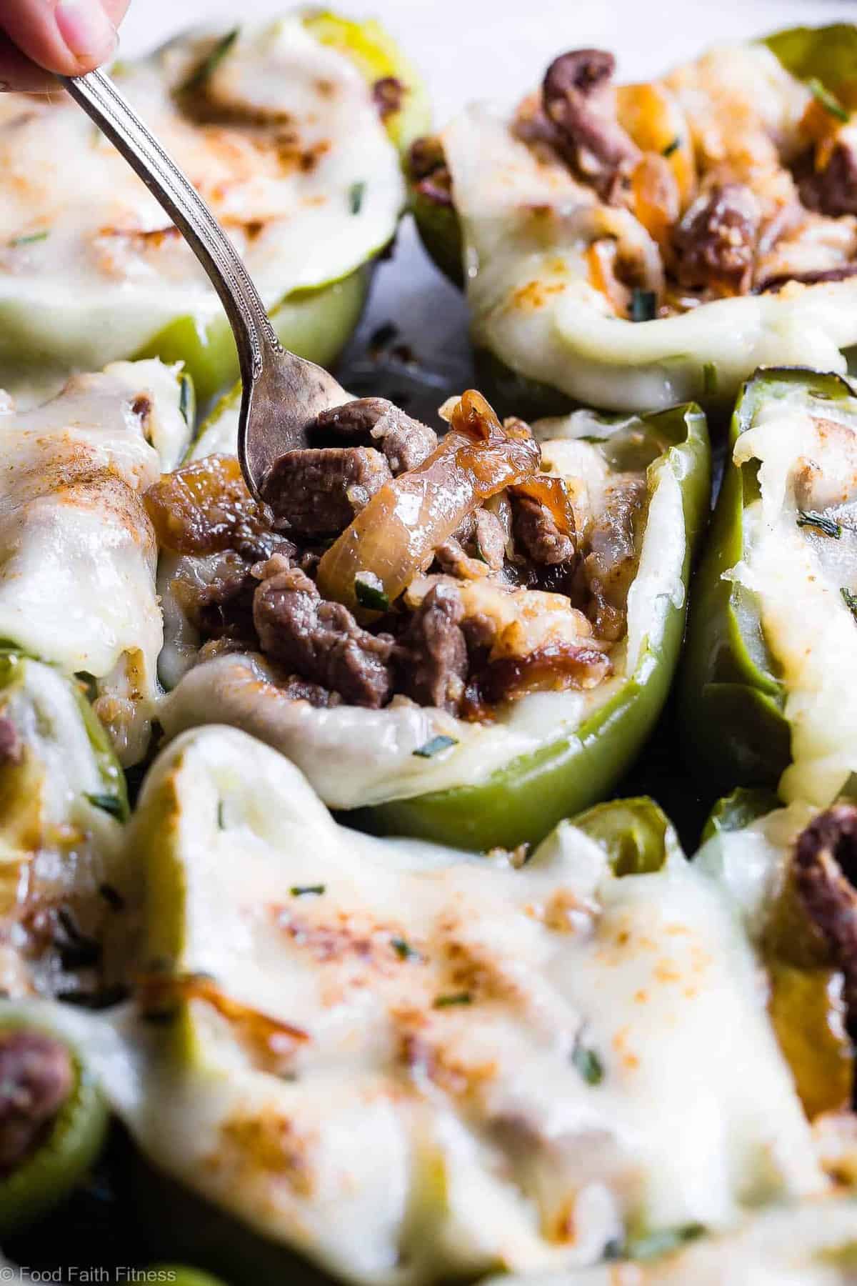 Cheesesteak Stuffed Peppers with a fork being stuck into them