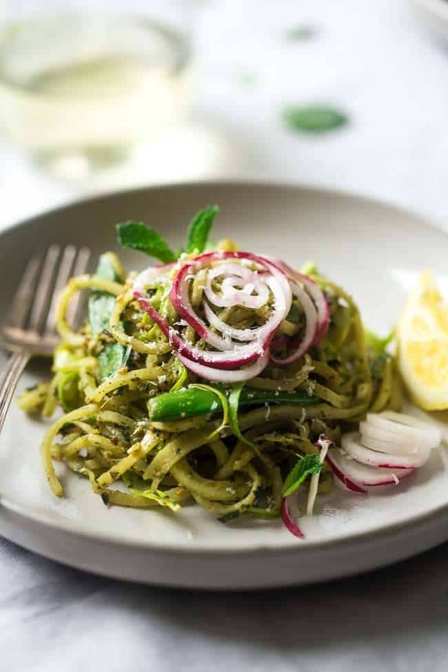 Turnip Noodle Pesto Pasta Salad with Peas and Asparagus – Spiralized turnips, asparagus and peas are tossed with pesto for a light, healthy and easy Spring meal! Low carb, gluten free and Vegetarian! | Foodfaithfitness.com | @FoodFaithFit