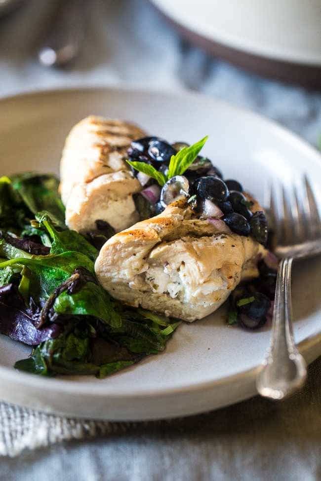 Grilled Goat Cheese Stuffed Chicken Breasts with Balsamic Blueberry Salsa – A 30 minute, easy, healthy dinner that feels fancy! Perfect for summer entertaining! | Foodfaithfitness.com | @FoodFaithFit