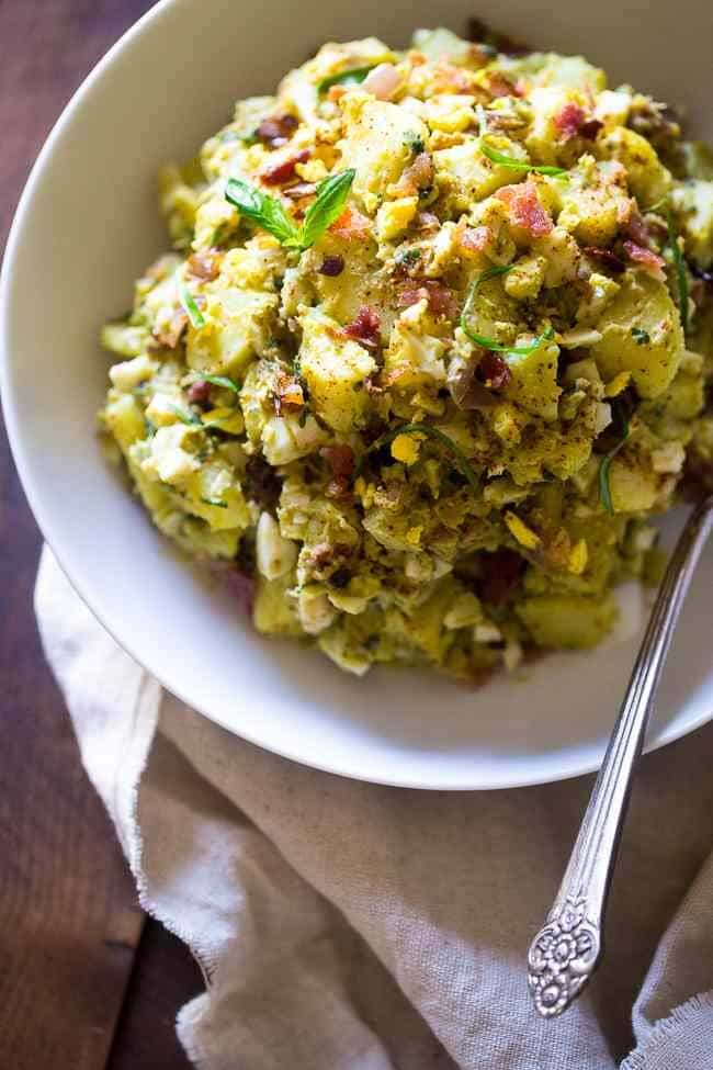Paleo Sweet Potato Salad with Bacon, Eggs and Avocado Pesto – A healthy side dish that is SUPER creamy, easy to make and always a crowd pleaser! You won’t even miss the mayonnaise! | Foodfaithfitness.com | @FoodFaithFit