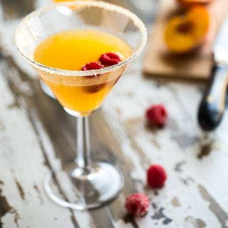 Skinny Raspberry Peach Martini - An easy, sugar free martini with only 150 calories! Perfect for summer entertaining! | Foodfaithfitness.com | @FoodFaithFit