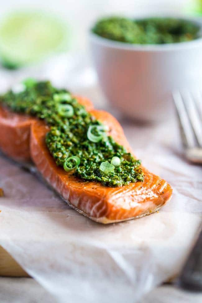 Baked Salmon with Asian Cilantro Pesto - A simple, healthy and easy dinner that feels SO fancy, but is ready in under 30 minutes! It's gluten free, low carb and only 300 calories! | Foodfaithfitness.com | @FoodFaithFit