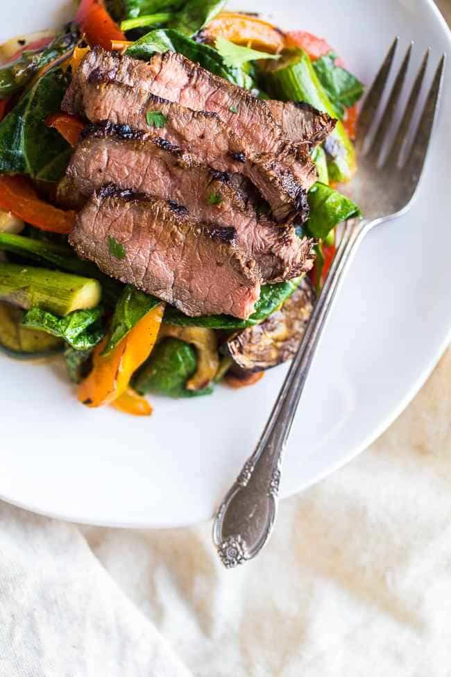 Paleo Grilled Beef Stir Fry with Asian Almond Dressing- Beef and veggies are grilled and then tossed with a creamy Asian almond butter vinaigrette and spinach for a quick and easy, healthy, Paleo-friendly meal! | Foodfaithfitness.com | @FoodFaithFit