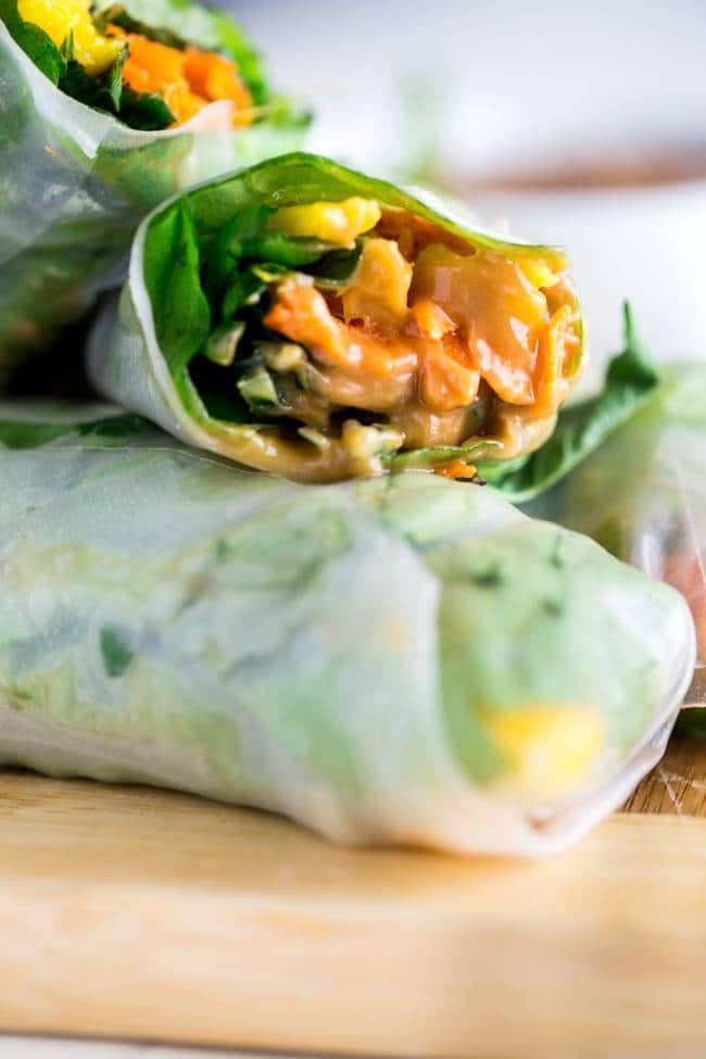 Vegan Spiralized Cucumber Noodles Mango Summer Rolls with Almond Coconut Dip - These summer rolls are made with mango and cucumber noodles, instead of rice noodles, to make them lower carb. Serve them with almond butter and coconut dip for a light and healthy, raw meal! | Foodfaithfitness.com | @FoodFaithFit