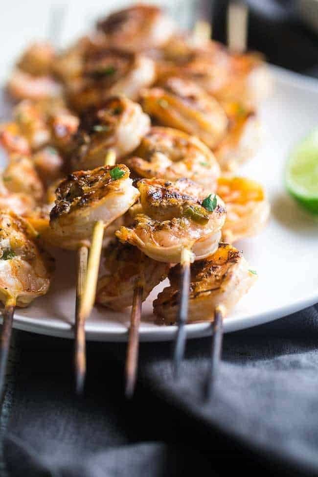 Cilantro Lime Grilled Shrimp with Avocado Cilantro Dip - Marinated in lime juice, honey and jalapeno pepper, then grilled for a quick and easy, healthy meal that's gluten free, low carb and low fat! | Foodfaithfitness.com | @FoodFaithFit