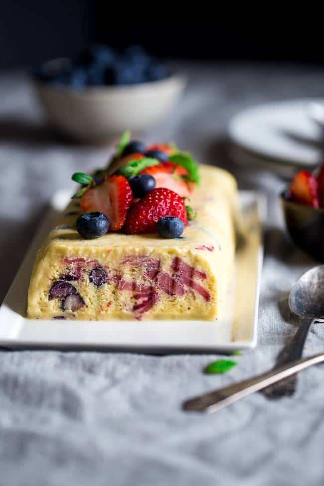 Paleo Red, White and Blueberry Lemon Honey Semifreddo Recipe - This frozen, mousse-like dessert uses honey and coconut milk to make it healthy, and only 160 calories a slice! It's loaded with berries and is creamy and refreshing! Perfect for July 4th! | Foodfaithfitness.com | @FoodFaithFit