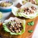 Vegetarian Lettuce Wraps with Jerk Grilled Tofu - These lettuce wraps are piled with spicy-sweet and crispy grilled tofu and pineapple salsa. They're a quick and easy, healthy meal for Summer grilling or Meatless Monday! | Foodfaithfitness.com | @FoodFaithFit